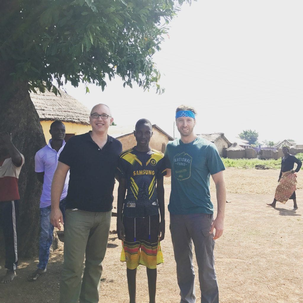 Dr. Ryan and two friends posing on mission trip