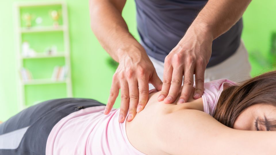 A Woman Receiving Chiropractic Adjustments For Infertility