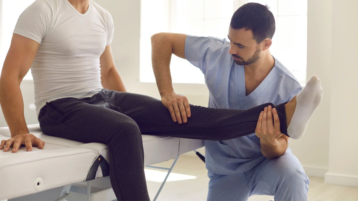 A Chiropractor Adjusting Persons Feet