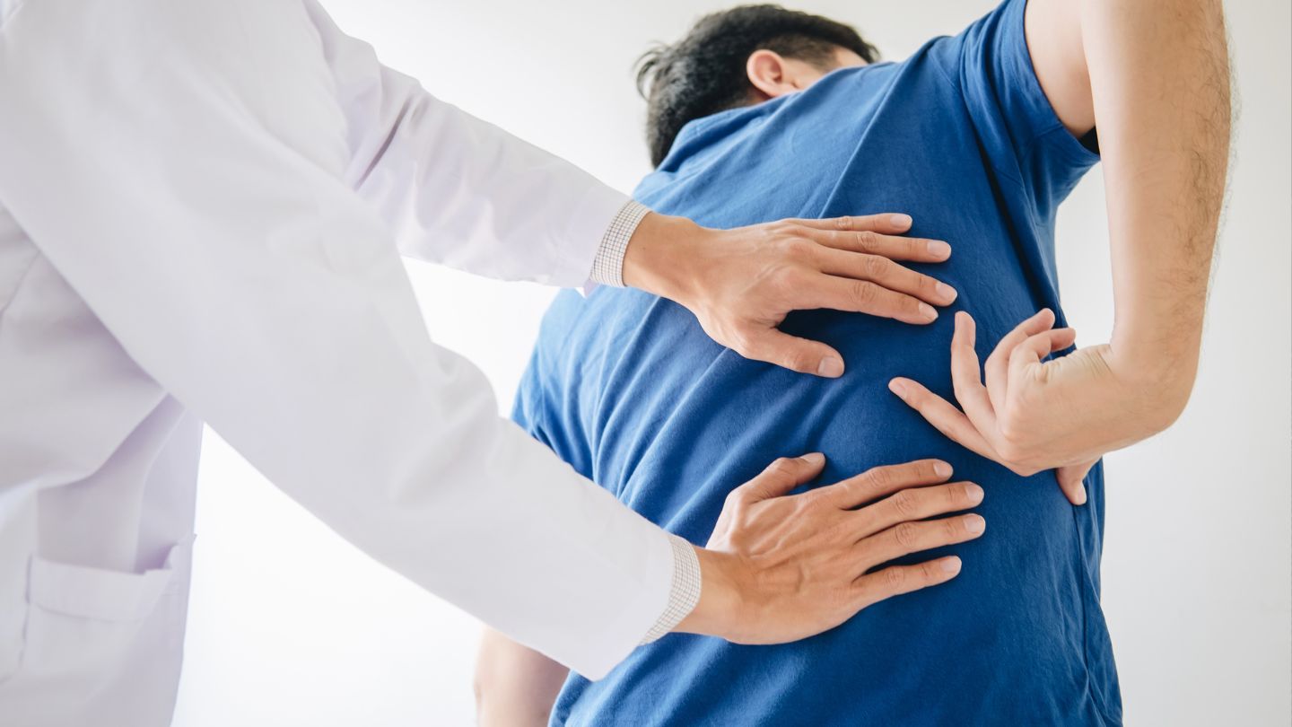 Chiropractor Checking Patient's Back