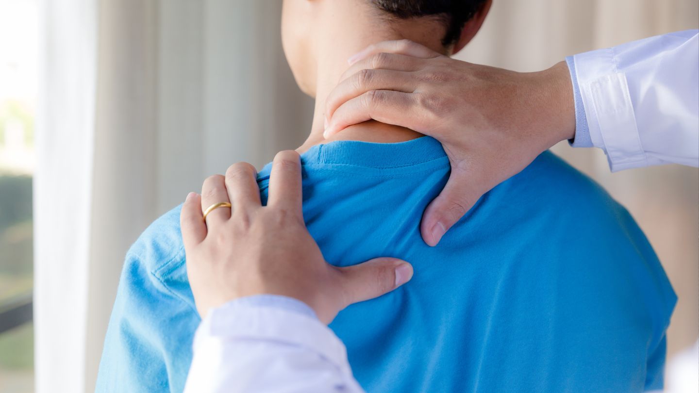 Chiropractor Performing Neck Adjustment