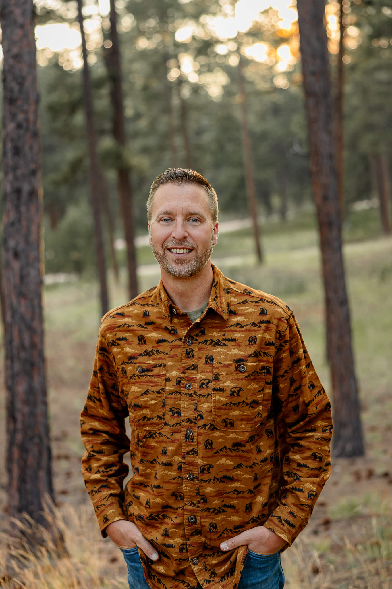 Dr. Ryan with Radix Chiropractics headshot. Surrounded by the forest.